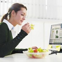 woman eating salad